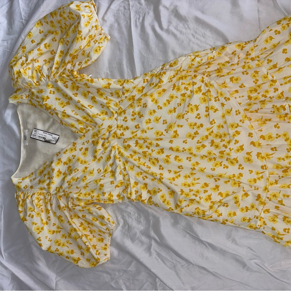 rahi dress yellow with flower detailing. mini with ruffles and poofy sleeves